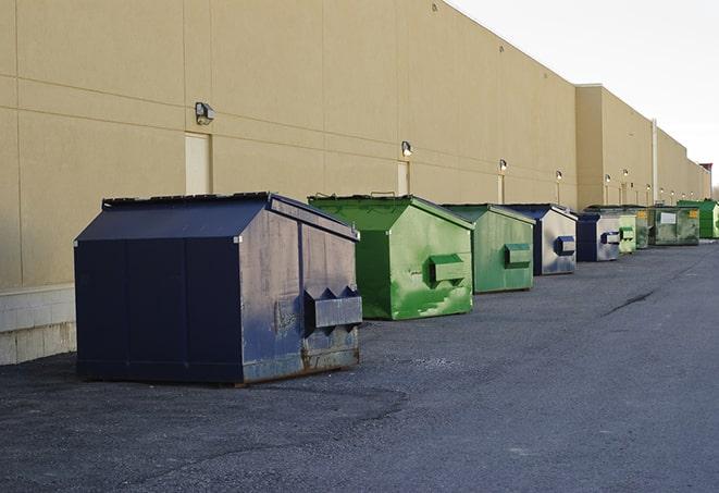 a group of construction workers taking a break near a dumpster in Gulf Stream